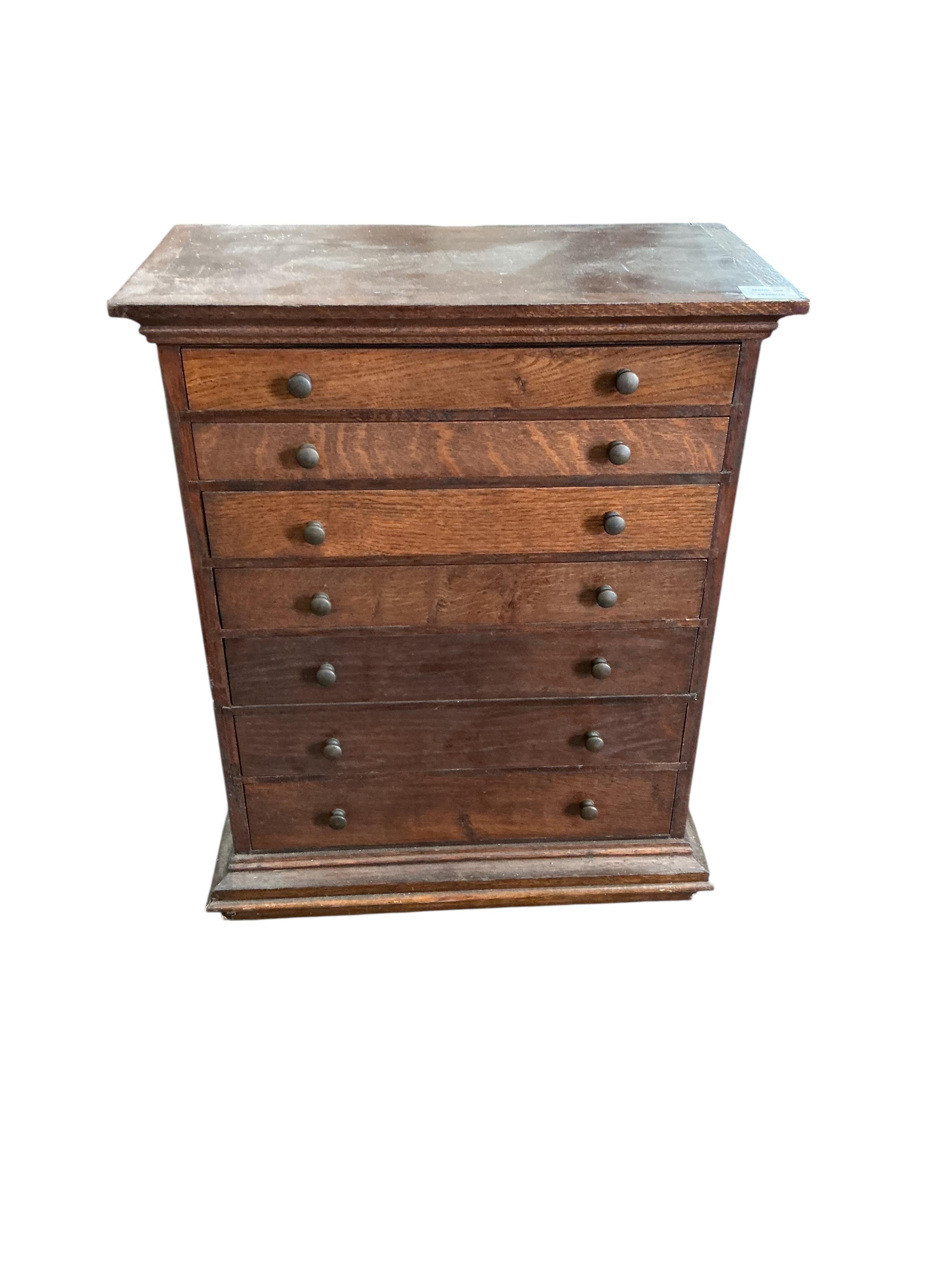 An early 20th century oak seven drawer collectors chest, width 51cm, depth 27cm, height 63cm